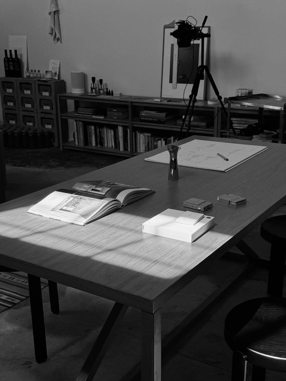 Person working at a desk beside a window.